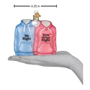 A clear glass mr. & mrs. hoodies ornament featuring two hooded sweatshirts in light blue and gray as a couples ornament