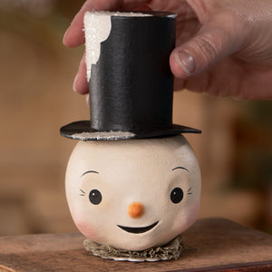 A charming white mr snowman container with a black top hat and orange nose perfect as a jolly bobble snowman decor