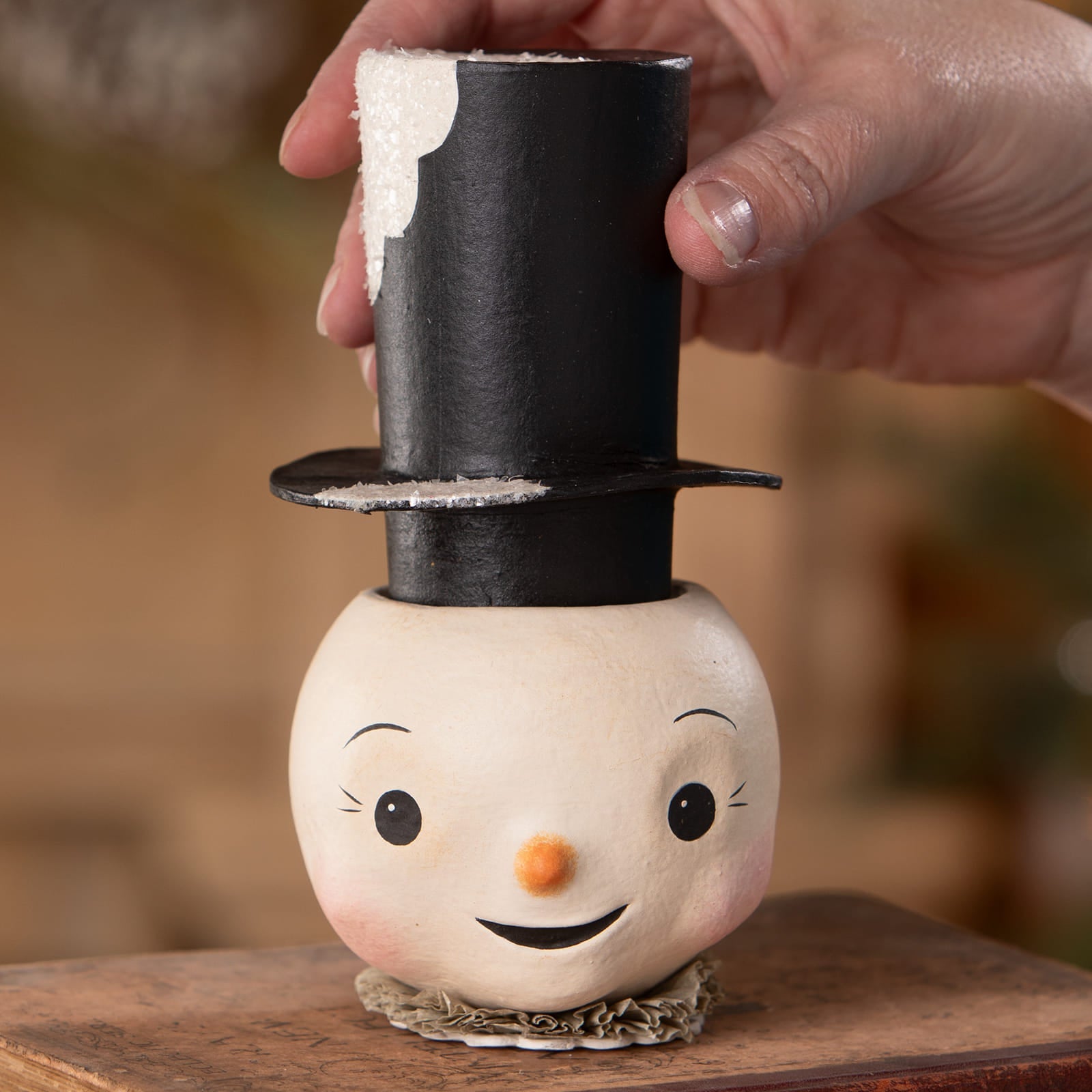 Mr snowman container jolly bobble snowman with white body, black top hat, carrot nose, and rosy cheeks for christmas decor