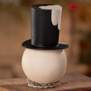 A cream jolly bobble snowman container with a glossy black top hat and ruffled base perfect for christmas snowman decor