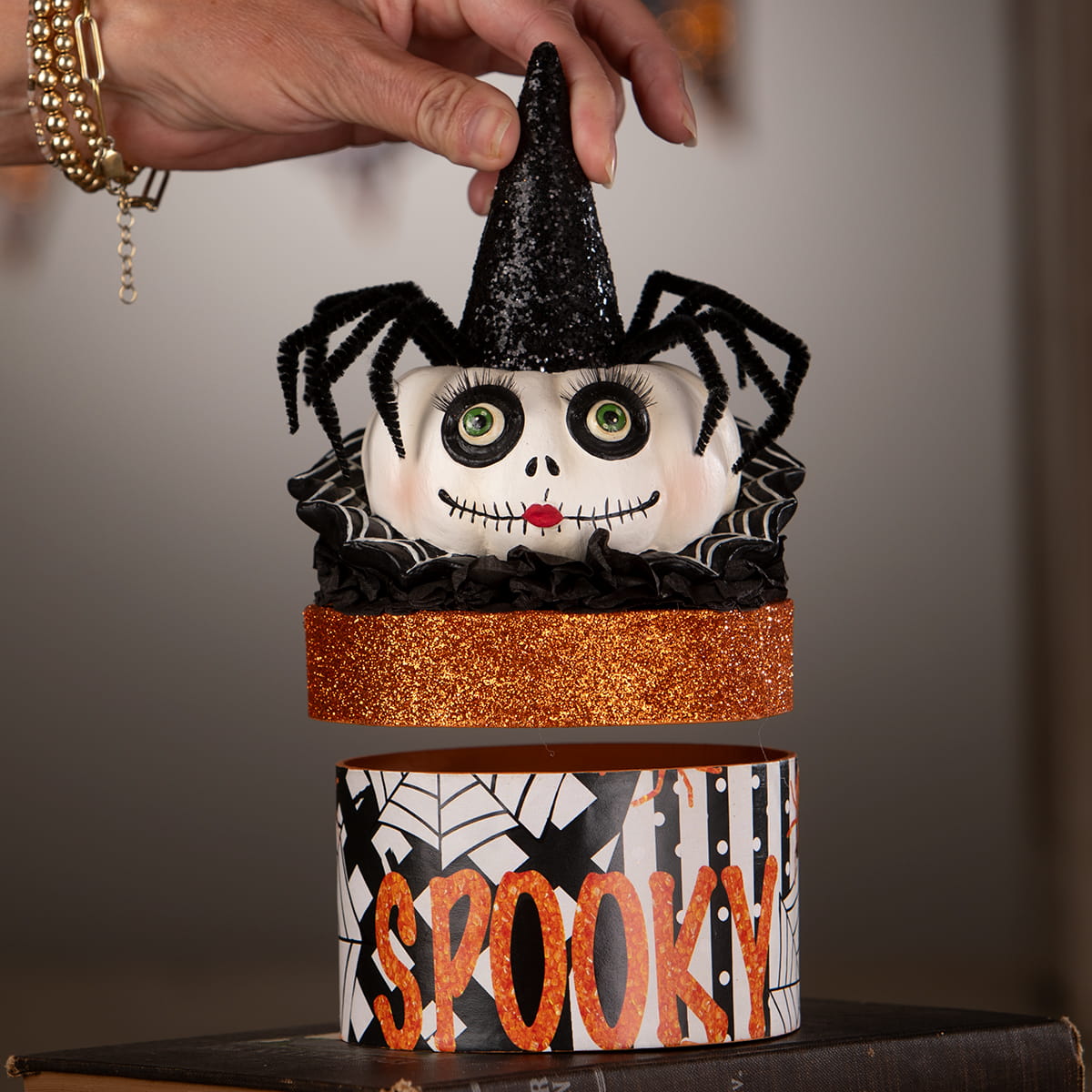 Mrs casperita halloween box with white skull face black glittery witch hat spider legs on orange glitter band