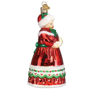 Red and green glass mrs claus ornament featuring a woman in a festive textured dress with white trim santa ornament