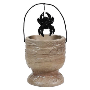 Halloween-themed candy bucket designed to look like a mummy’s wrappings with a hanging spider decoration.