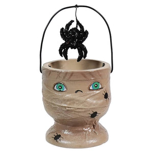 Halloween-themed candy bucket shaped like a mummy’s head with a spider hanging above it.