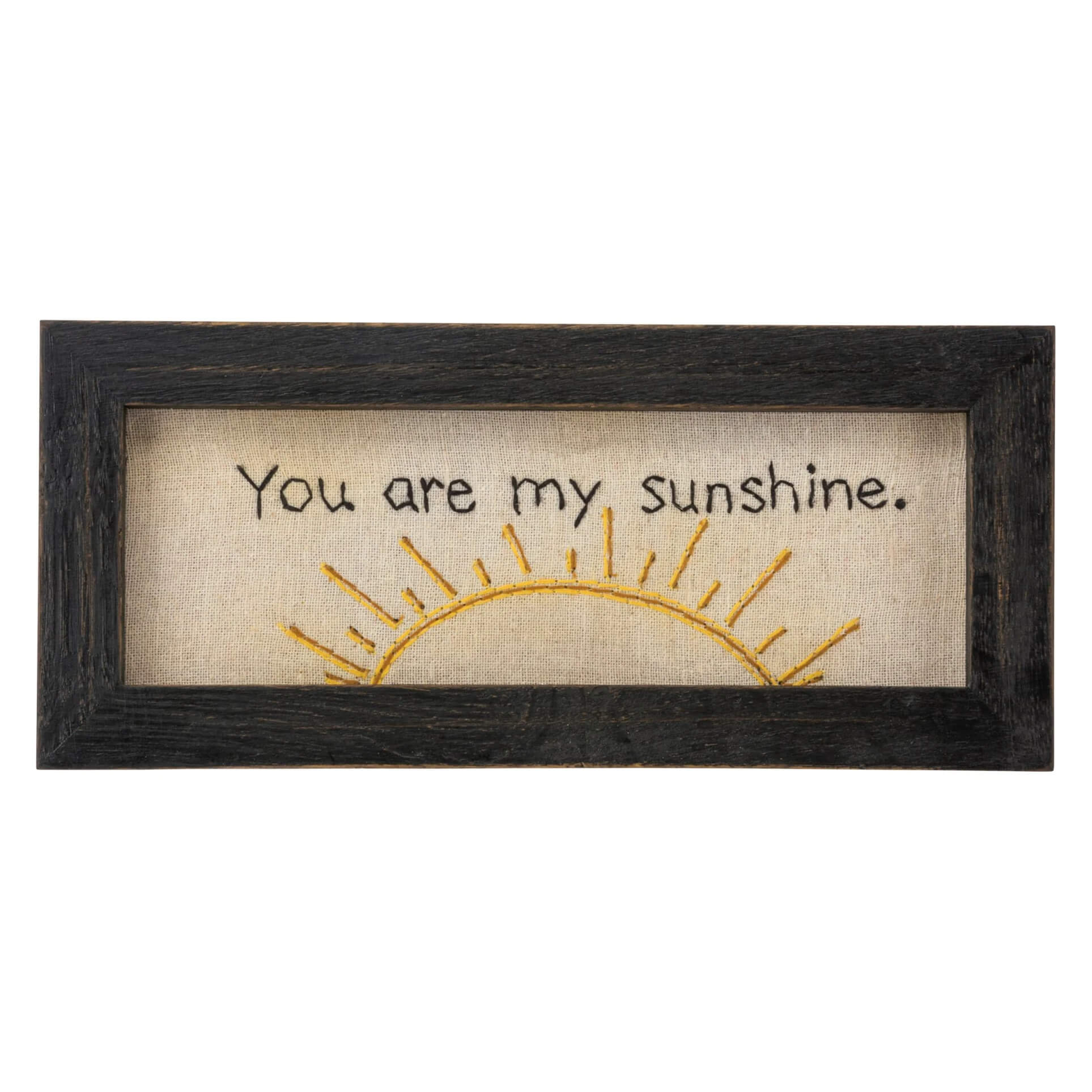 A rustic black-framed stitchery wall decor on beige linen with you are my sunshine and golden sunburst for valentine’s day tabletop