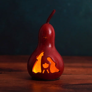 Red carved natural gourd lantern with glowing orange light and star design from meadowbrooke gourds