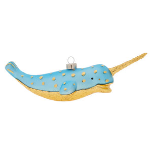 A light blue glass nautical narwhal ornament with gold foil spots and a long golden tusk perfect as a santa ornament