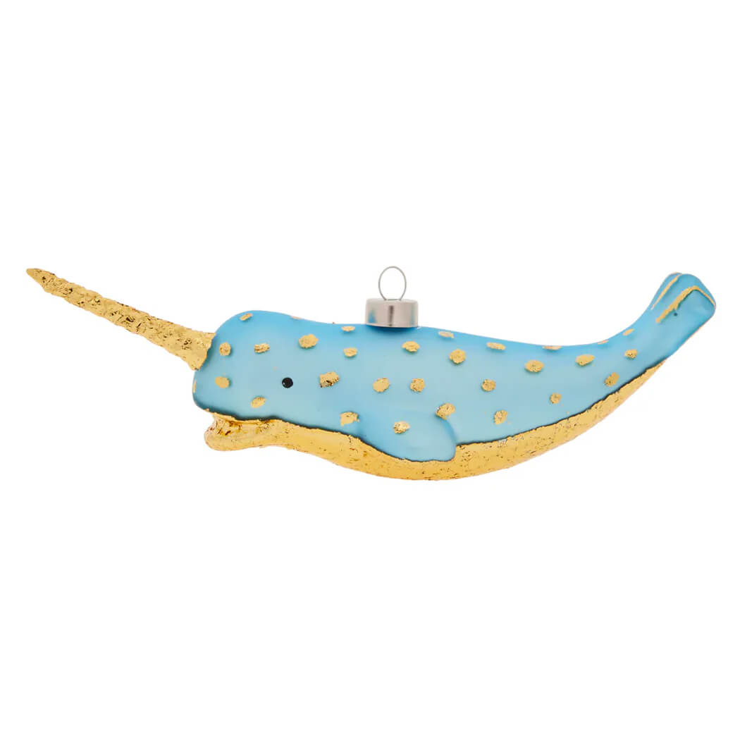 A light blue glass nautical narwhal ornament with gold foil polka dots and a golden horn perfect as a santa ornament