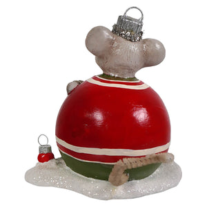 A gray mouse figurine in a red and white striped santa outfit with green trim sitting on a glittery snow base by bethany lowe designs tree memzi mouse
