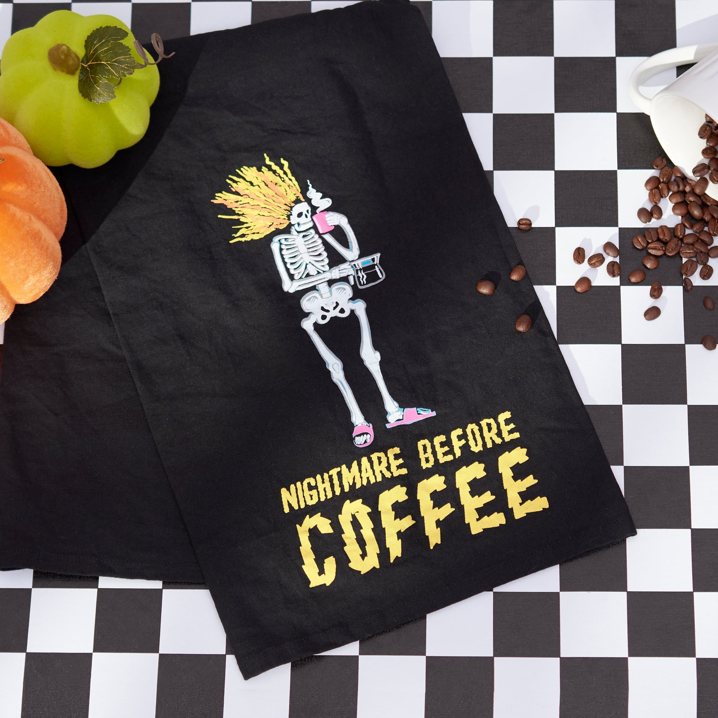Black embroidered inn kitchen towel with skeleton holding coffee and nightmare before coffee text dead and breakfast style
