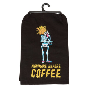 Black fabric inn kitchen towel with cartoon skeleton holding coffee cup and nightmare before coffee text in bold yellow