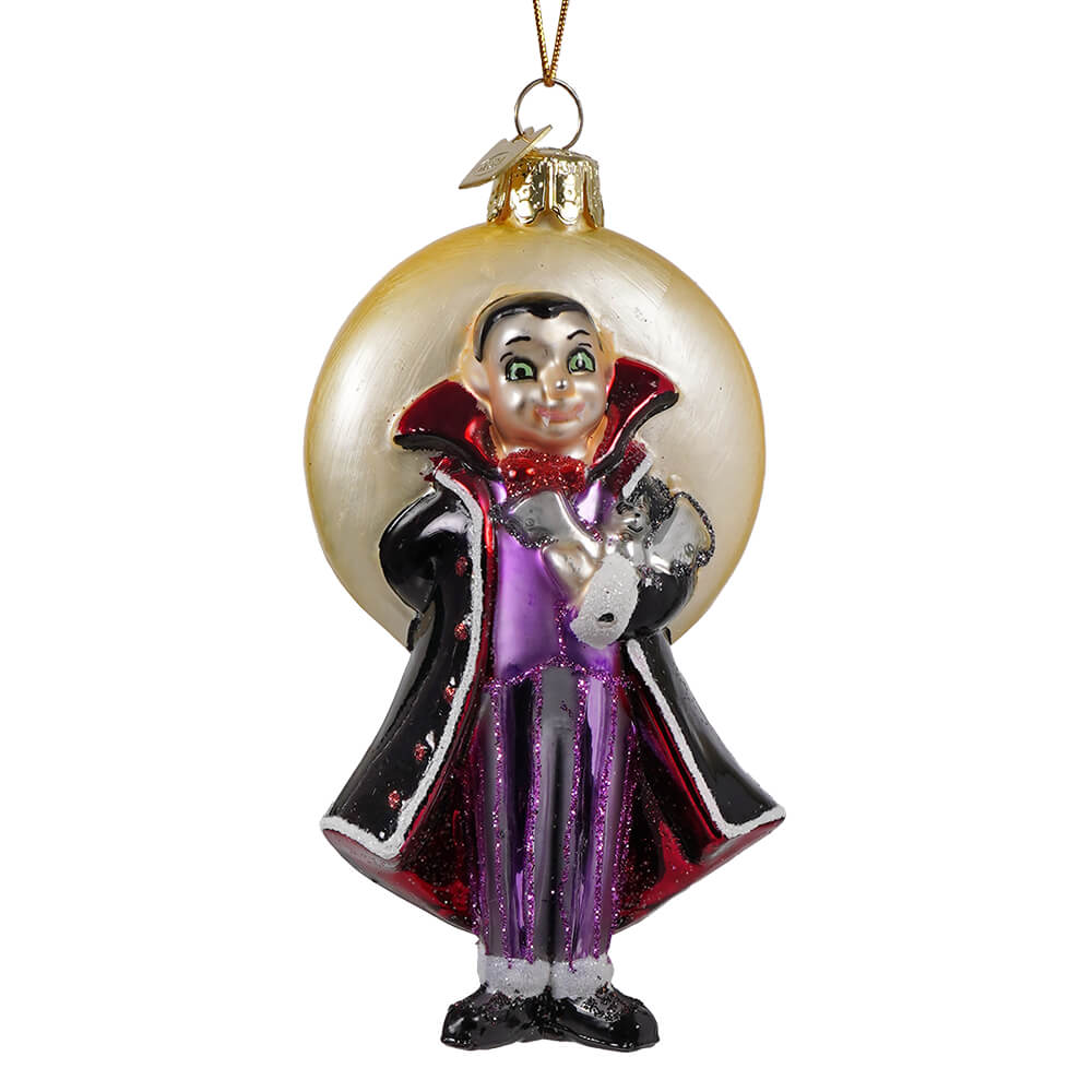 Noble gems glass halloween vampire ornament featuring a glossy glass vampire in black and purple cape holding a silver moon