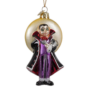 Noble gems glass halloween vampire ornament featuring a glossy glass vampire in black and purple cape holding a silver moon