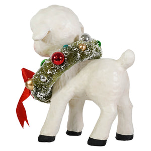 White ceramic noelle lamb figurine by bethany lowe design with green frosted wreath and colorful ornaments