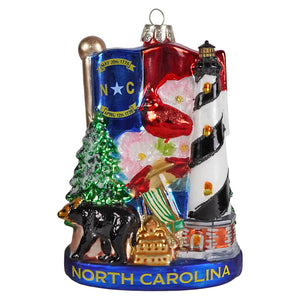 North carolina glass ornament made of clear glass with state shape and red ribbon for holiday decor