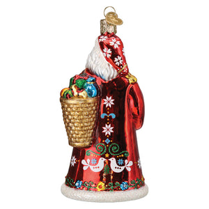Red glass norwegian santa ornament with white floral bird patterns and gold basket filled with colorful ornaments
