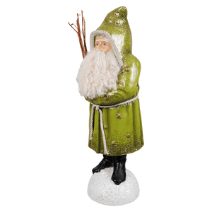 A glittery green belsnickle santa figurine with a white beard holding twigs from bethany lowe designs