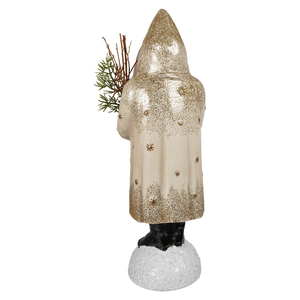 Nostalgic winter belsnickle cream and gold glittery santa figurine holding evergreen branch spreading holiday cheer