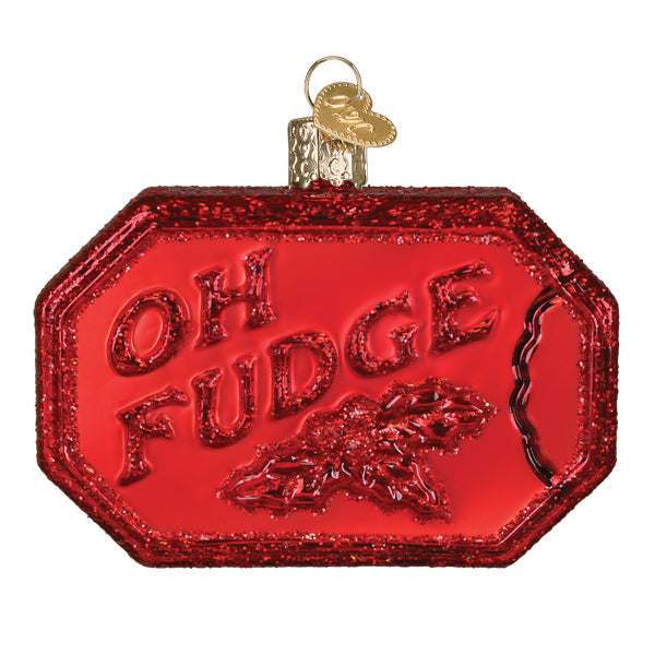 Red glittery glass figural decor shaped like a candy wrapper with oh fudge embossed perfect as a hand sanitizer ornament