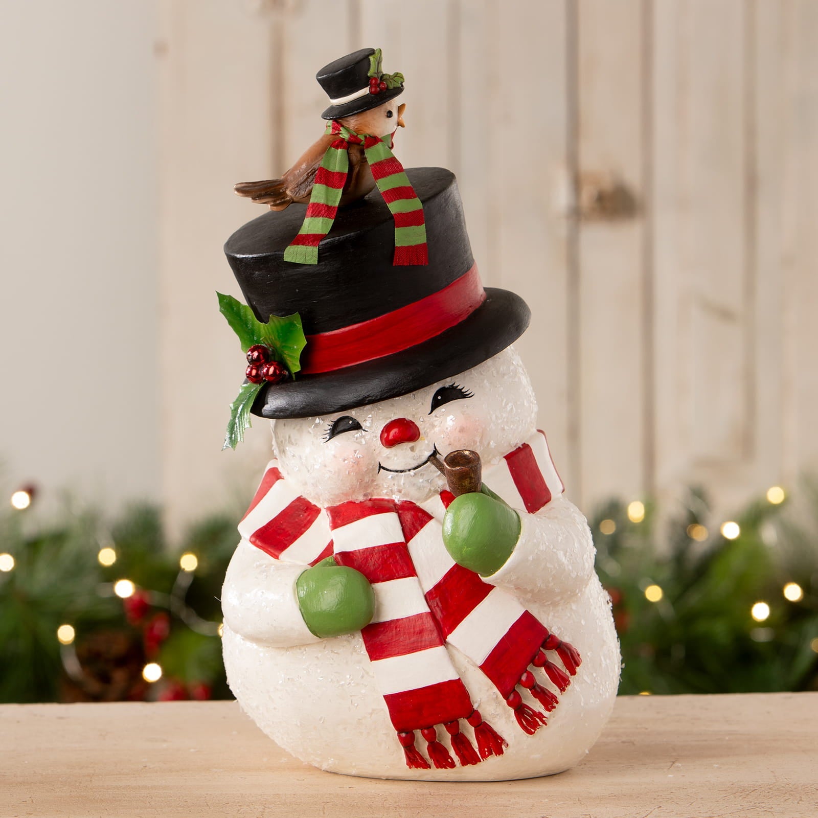 A charming white bethany lowe designs oh happy day snowman figurine with a black top hat and red scarf perfect for christmas snowman figures and decor