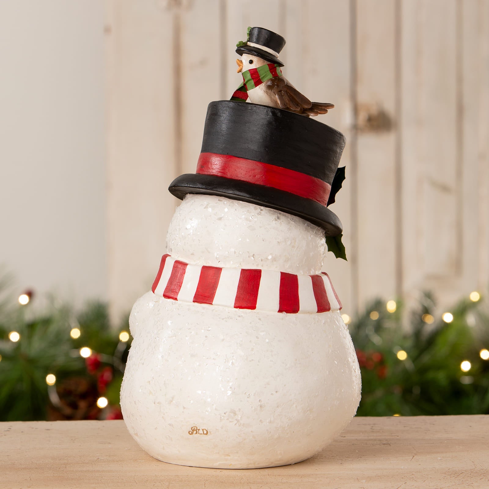 A charming white glittery snowman figurine with a black top hat and striped scarf from bethany lowe designs christmas snowman figures decor