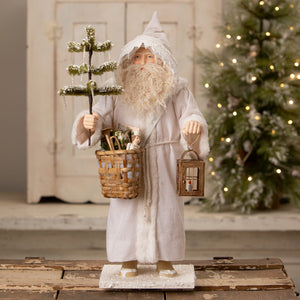 Old man winter santa by bethany lowe designs is a white santa figure with a fluffy robe holding a tree lantern basket