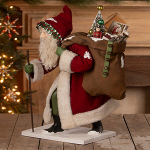 Old st nick santa figure by bethany lowe designs with red and white suit green-trimmed hat and bag of toys