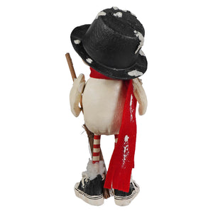 A whimsical olef flake snowman figurine by bethany lowe designs with a black top hat red scarf and candy cane legs