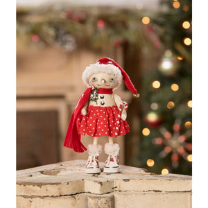 A charming handmade olympia flake christmas doll by bethany lowe designs wearing a santa hat and polka dot dress