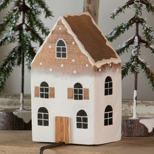 A charming white and brown wooden ombre house stocking holder with a rustic hand-painted finish for christmas stockings
