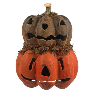 Rustic orange and brown black two layered carved pumpkin jack-o-lantern with moss accents for halloween pumpkins and gourds decor