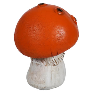Orange creepy mushroom figurine with an orange cap, black bead eyes, and a white textured stem