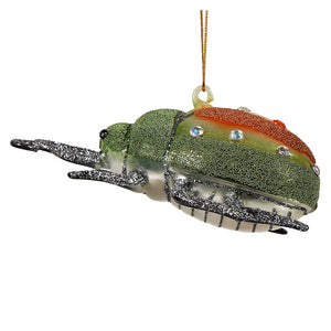 Orange and green beaded and bejeweled glass beetle ornament with silver tipped wings and clear rhinestones