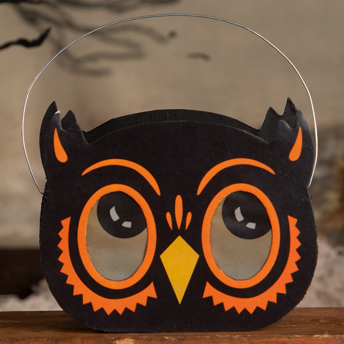 Black owl halloween bucket luminary with bright orange and yellow accents and a wire handle for treats or lanterns