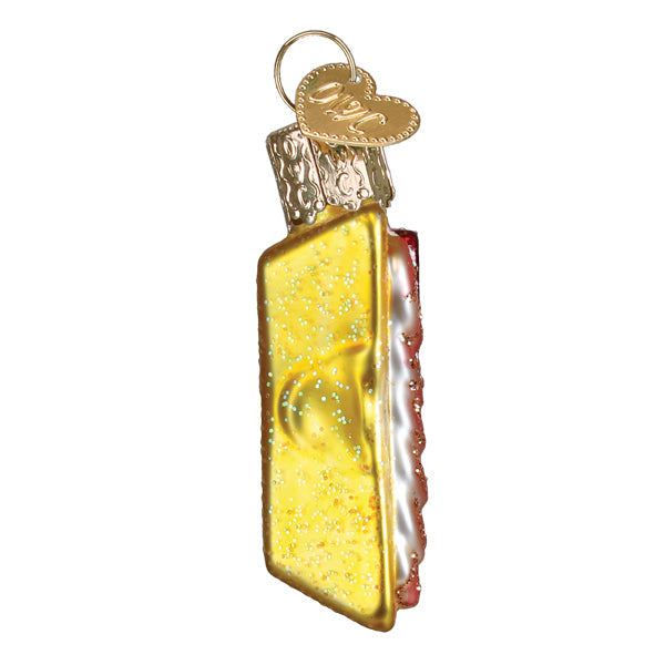 Golden glittery cake slice ornament with silver and red icing border and heart tag perfect as figural decor or tree topper