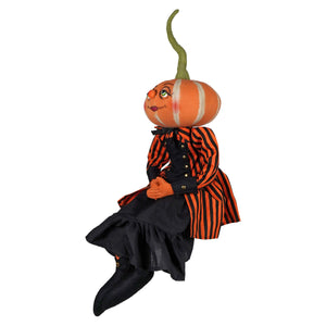 Orange pumpkin headed padma pumpkin doll wearing striped jacket and boots from joe spencer halloween dolls & decor