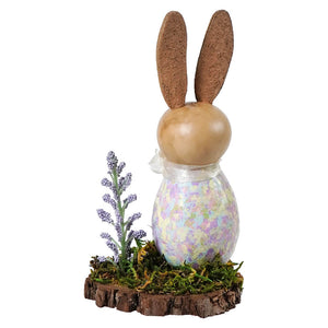 A paige bunny gourd figurine with cork ears and iridescent pastel egg body in a meadowbrooke gourds bunny gourd scene