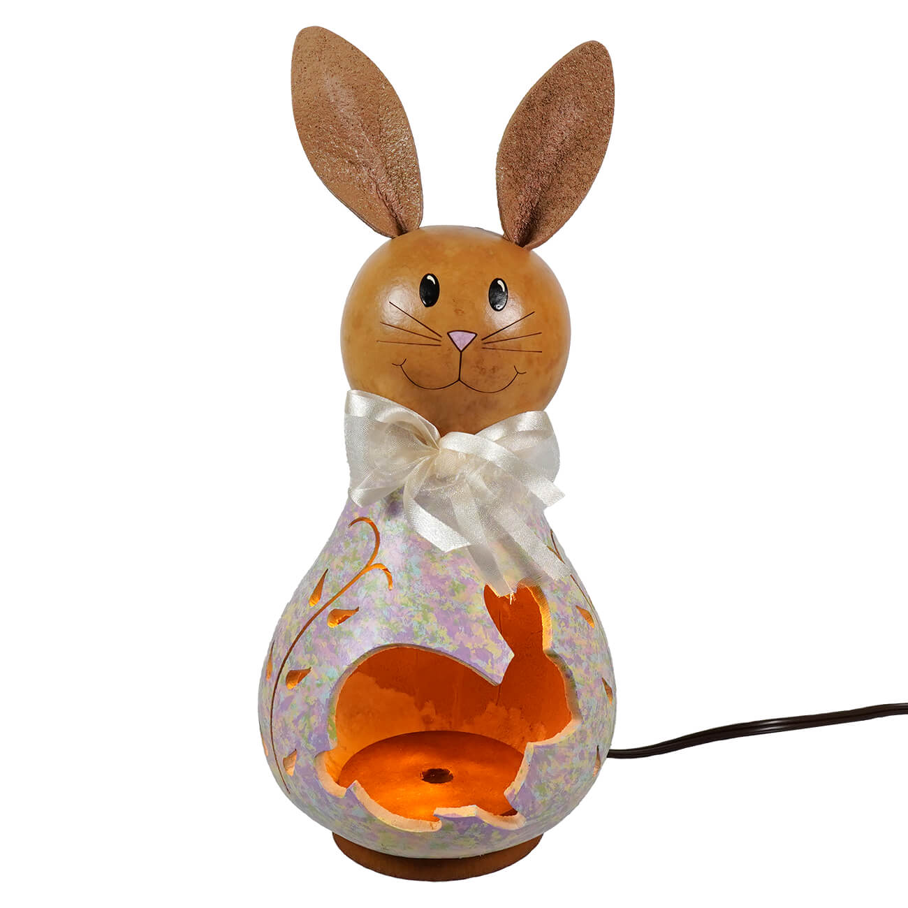 A charming brown wooden easter bunny lamp with a white satin bow and orange-lit lighted bunny interior