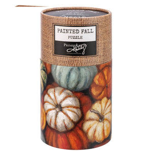 Cylindrical painted fall 1000 piece pumpkin puzzle with colorful pumpkin designs on burlap textured top and bottom