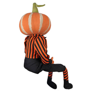 Pascal pumpkin figurine with orange pumpkin head wearing black and orange striped shirt and socks by joe spencer’s gathered pumpkin doll