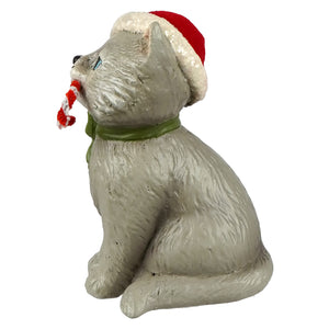 Gray ceramic kitty figurine wearing a red and white santa hat with green scarf holding a candy cane bethany lowe design
