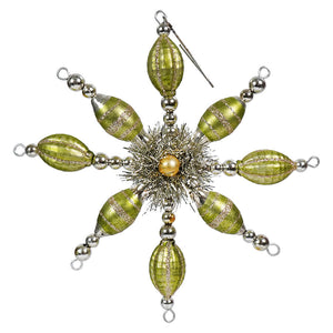 Ornate green and silver snowflake-shaped Christmas ornament with beaded arms.