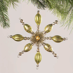 Ornate gold and silver snowflake-shaped Christmas tree ornament with elongated teardrop beads.