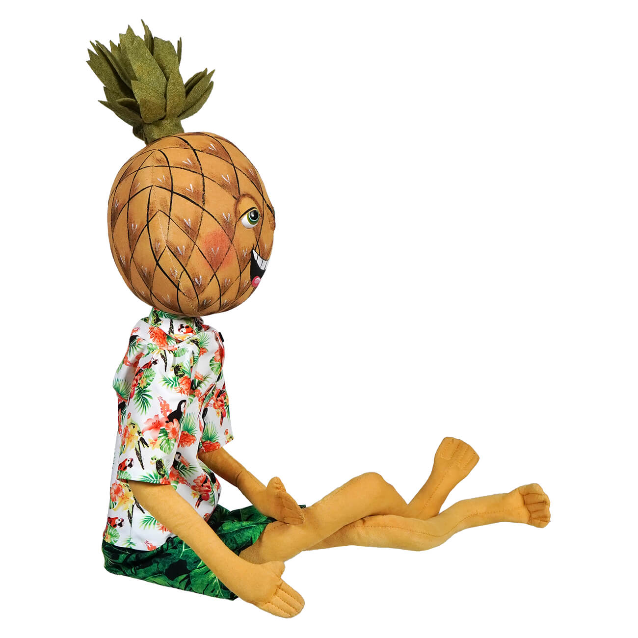 Whimsical doll figure with a pineapple head wearing a floral shirt and green shorts.