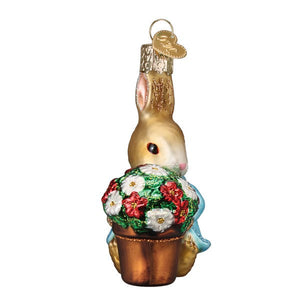 Golden glass peter rabbit ornament with bunny holding red and white flowers beatrix potters figural decor