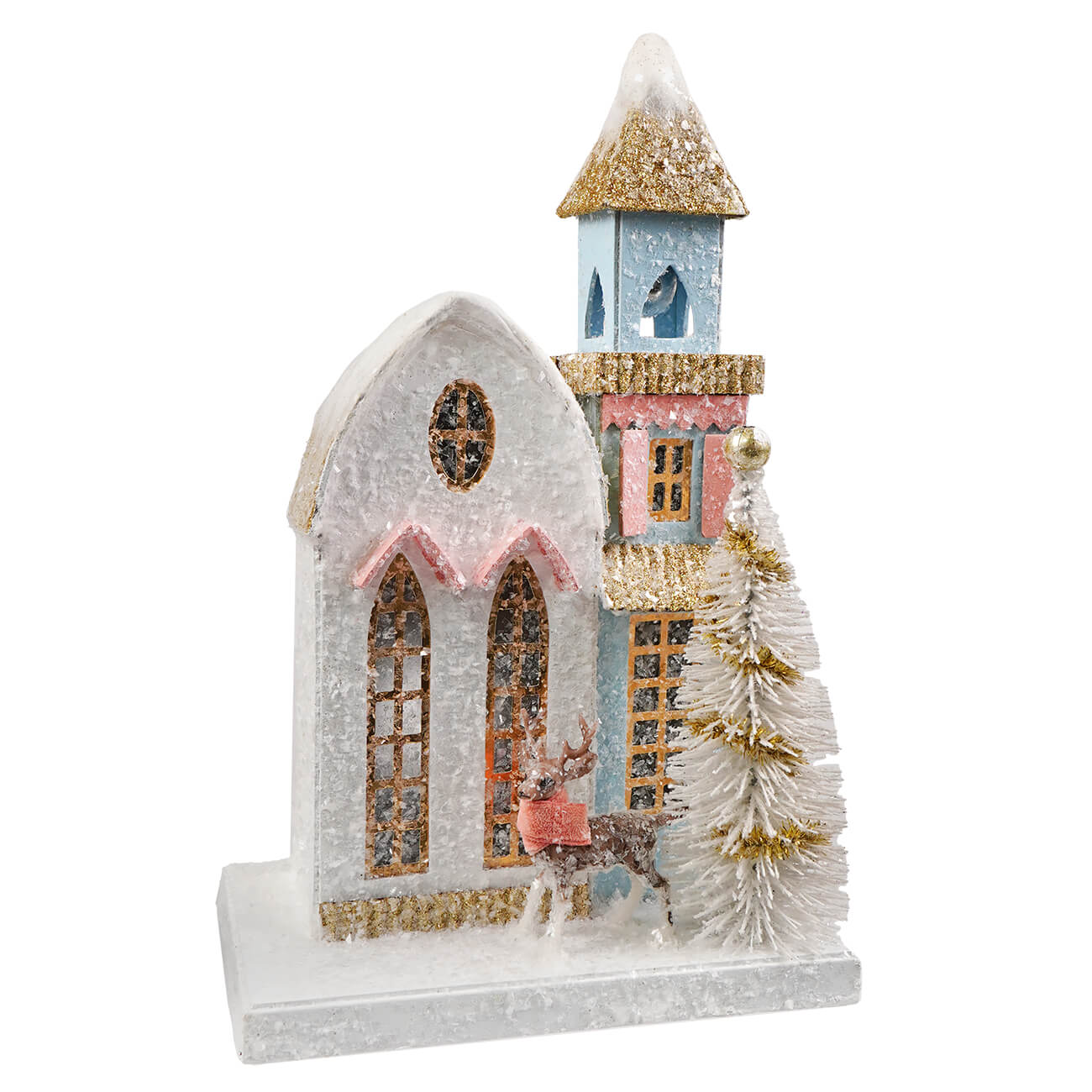 A petite winter village scene with a snow-dusted church, pink trim house, glittery blue tower, white tree, and deer figure