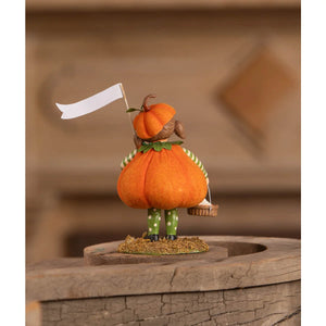Petunia pumpkin pie orange pumpkin figurine with green polka-dot leggings and striped shirt holding white flag by bethany lowe