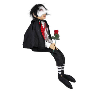 A black and white vampire figurine phantom phillip holding a red rose wearing a cape and red vest from joe spencers gathered traditions