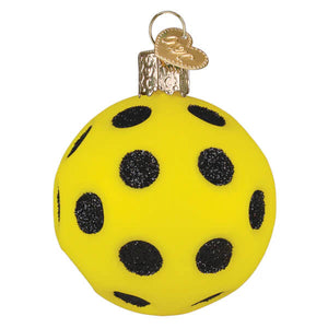 Bright yellow glass pickleball ornament with black glitter polka dots and a gold heart-shaped tag
