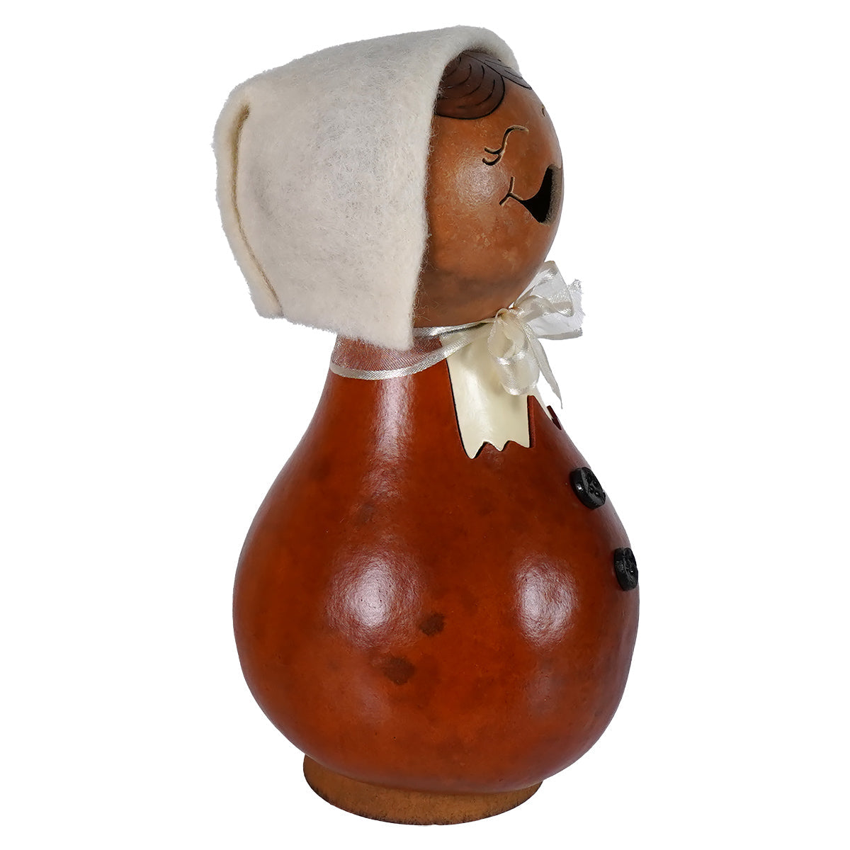 A charming hand carved wooden pilgrim lady gourd figurine by meadowbrooke gourds artisans with a white bonnet and ribbon